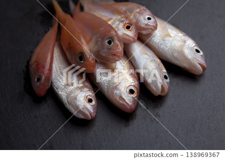 Fresh Red Coral Fish on Granite Surface Fresh Red Coral Fish on Granite Surface 138969367