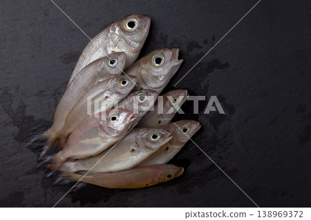 Fresh Red Coral Fish on Granite Surface Fresh Red Coral Fish on Granite Surface 138969372