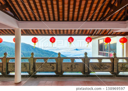 Red Chinese lanterns and carved railing at Chin Swee Caves Temple with sea of clouds view, Genting Highlands, Pahang, Malaysia 138969597