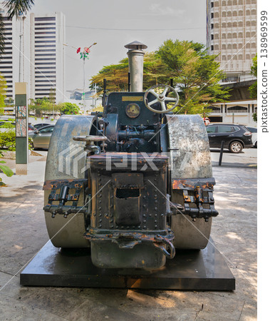 Historical steamroller on Jalan Parlimen street beside Gombak River, Kuala Lumpur, Malaysia Historical steamroller on Jalan Parlimen street beside Gombak River, Kuala Lumpur, Malaysia 138969599