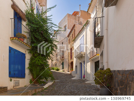 Narrow old street with white houses in Cadaques, Catalonia, Spain 138969745