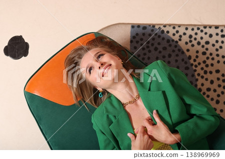 Woman smiling confidently. Female in bright attire enjoying sunlight Woman smiling confidently. Female in bright attire enjoying sunlight 138969969