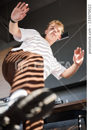 White male actor reaching out in rehearsal with surprise White male actor reaching out in rehearsal with surprise 138970022