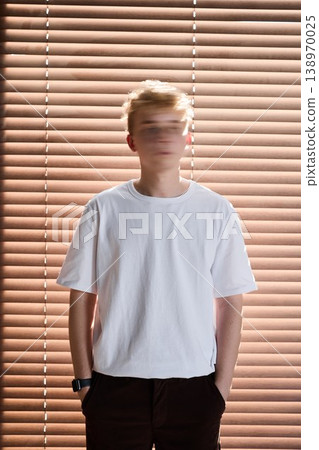 Portrait of young individual under streaked lighting effects Portrait of young individual under streaked lighting effects 138970025
