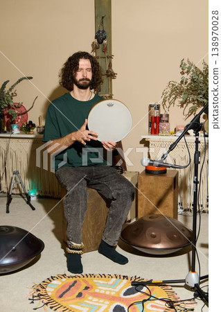 Caucasian music teacher demonstrating percussion technique Caucasian music teacher demonstrating percussion technique 138970028