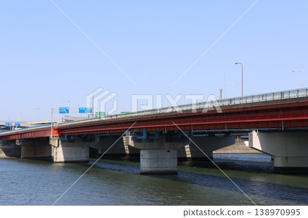 A view of the Ichikawa Ohashi Bridge spanning the Edogawa River against a blue sky (National Route 357, Wangan Road) A view of the Ichikawa Ohashi Bridge spanning the Edogawa River against a blue sky (National Route 357, Wangan Road) 138970995