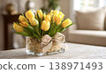 Yellow tulip bouquet decorating a living room coffee table 138971493
