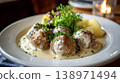 Swedish meatballs with creamy sauce, potatoes, and fresh salad 138971494
