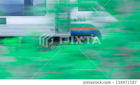 JR Kyushu's Limited Express Midori speeds through the greenery. 138972187