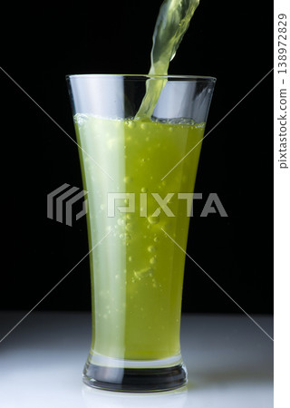 A glass of green juice drink A glass of green juice drink 138972829