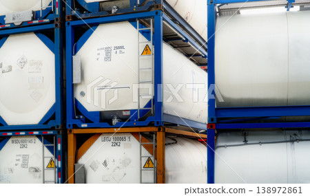 Chemical tank container. ISO tank container for chemical delivery. Bulk liquid transport. Chemical company. Container freight area. Global logistics business. Chemical container for truck transport. Chemical tank container. ISO tank container for chemical delivery. Bulk liquid transport. Chemical company. Container freight area. Global logistics business. Chemical container for truck transport. 138972861