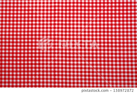 Red and white checkered tablecloth. Top view table cloth texture background. Red gingham pattern fabric. Picnic blanket texture. Red table cloth for Italian food menu. Square pattern of gingham. Red and white checkered tablecloth. Top view table cloth texture background. Red gingham pattern fabric. Picnic blanket texture. Red table cloth for Italian food menu. Square pattern of gingham. 138972872