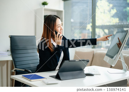 Woman freelancer is working her job on computer tablet and laptop Doing accounting analysis report real estate investment Woman freelancer is working her job on computer tablet and laptop Doing accounting analysis report real estate investment 138974141