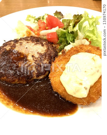 A hamburger and croquette lunch at a family restaurant. A hamburger and croquette lunch at a family restaurant. 138974170
