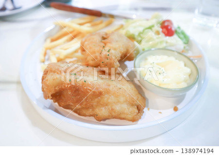 fish and chips or fried fish with French fries and salad fish and chips or fried fish with French fries and salad 138974194