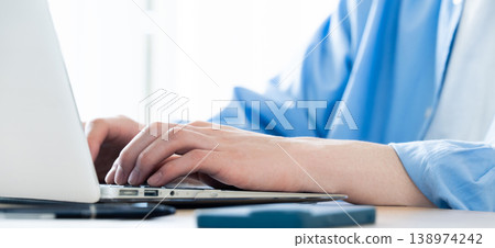 Hand of a man working on a computer Hand of a man working on a computer 138974242