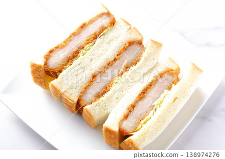 Katsu Sandwich - A katsu sandwich that is soft, juicy, and packed with the delicious flavor of pork cutlet. Katsu Sandwich - A katsu sandwich that is soft, juicy, and packed with the delicious flavor of pork cutlet. 138974276