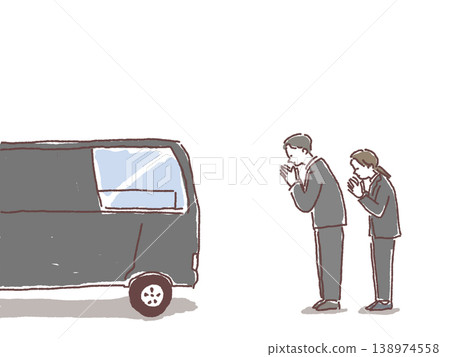 一男一女在靈車前祈禱。 一男一女在靈車前祈禱。 138974558