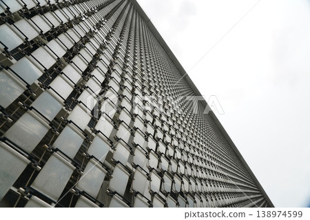 Modern Building Facade with White Panels and Sky View Modern Building Facade with White Panels and Sky View 138974599