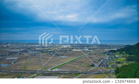 A view of the Sasagawa district in Asahi Town, Toyama Prefecture, in early spring, seen from the south. A view of the Sasagawa district in Asahi Town, Toyama Prefecture, in early spring, seen from the south. 138974668
