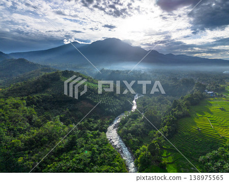 Beautiful morning view in Indonesia, panoramic landscape of rice fields with mountain ranges and clear sky Beautiful morning view in Indonesia, panoramic landscape of rice fields with mountain ranges and clear sky 138975565