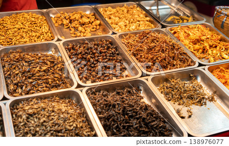 Exotic Thai Street Food Deep-Fried Insects at a Local Night Market 138976077
