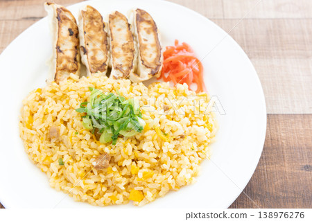 Delicious pan-fried dumplings and fried rice plate with pickled ginger 138976276