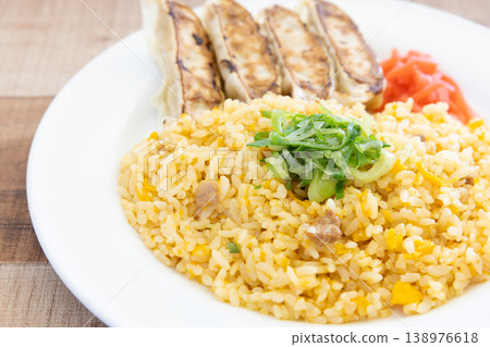 Delicious pan-fried dumplings and fried rice plate with pickled ginger 138976618