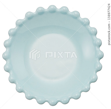 Cute light blue ceramic bowls and plates with cut-out borders against a white background. Cute light blue ceramic bowls and plates with cut-out borders against a white background. 138977424