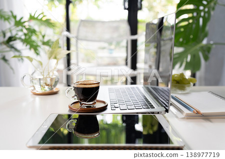 Cozy minimal workspace with coffee and laptop 138977719
