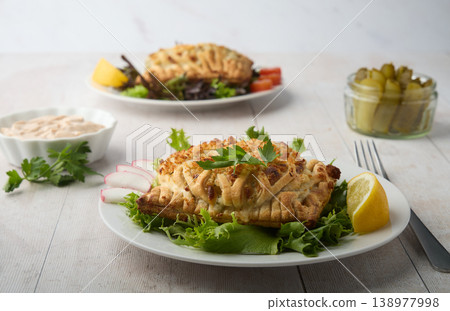 Savory Stuffed Pastry with Cheese and Fresh Salad 138977998