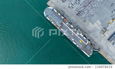 Aerial view cargo vehicles car carrier at import export cars terminal seaport, Vehicle car carrier vessel loading cars for shipping to worldwide, Automotive industry distribution logistic transport Aerial view cargo vehicles car carrier at import export cars terminal seaport, Vehicle car carrier vessel loading cars for shipping to worldwide, Automotive industry distribution logistic transport 138978019