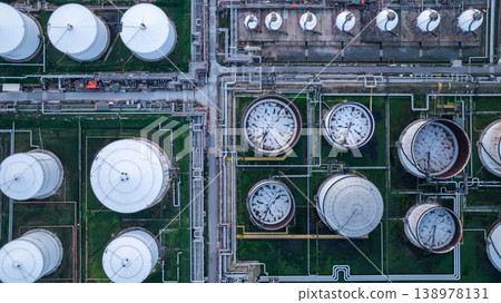 Aerial view white oil storage tank with pipeline steel, Crude oil industry, Storage fuel gas container tank petroleum refinery industrial factory, Oil storage chemical petrochemical refinery product. Aerial view white oil storage tank with pipeline steel, Crude oil industry, Storage fuel gas container tank petroleum refinery industrial factory, Oil storage chemical petrochemical refinery product. 138978131