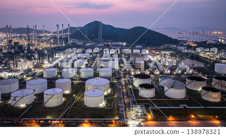 Aerial view Oil and Gas refinery plant at night, Global business energy logistic transportation, Oil and gas refinery petrochemical industrial, Petrochemical refinery industrial energy supply chain. Aerial view Oil and Gas refinery plant at night, Global business energy logistic transportation, Oil and gas refinery petrochemical industrial, Petrochemical refinery industrial energy supply chain. 138978321