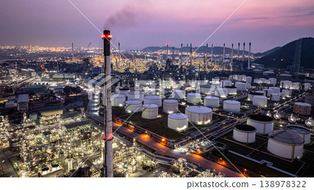 Aerial view Oil and Gas refinery plant at night, Global business energy logistic transportation, Oil and gas refinery petrochemical industrial, Petrochemical refinery industrial energy supply chain. 138978322