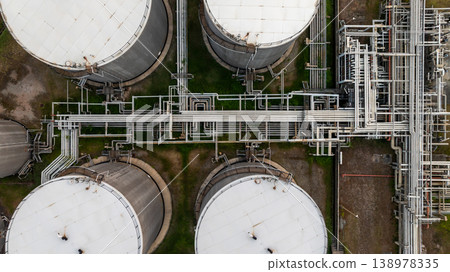 Aerial view oil and gas refinery petrochemical storage tank and pipeline steel, Oil and gas transportation system pipeline steel at oil and gas refinery industry chemical plant, Pipeline oil and gas. Aerial view oil and gas refinery petrochemical storage tank and pipeline steel, Oil and gas transportation system pipeline steel at oil and gas refinery industry chemical plant, Pipeline oil and gas. 138978335