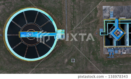 Aerial view circular clarifier tank at watewater treatment plant, Industrial infrastucture, Environment technology sustainable water management system, Semimentation tank circular clarifier. Aerial view circular clarifier tank at watewater treatment plant, Industrial infrastucture, Environment technology sustainable water management system, Semimentation tank circular clarifier. 138978343