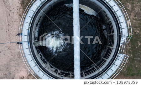 Aerial view circular clarifier tank at watewater treatment plant, Industrial infrastucture, Environment technology sustainable water management system, Semimentation tank circular clarifier. Aerial view circular clarifier tank at watewater treatment plant, Industrial infrastucture, Environment technology sustainable water management system, Semimentation tank circular clarifier. 138978359