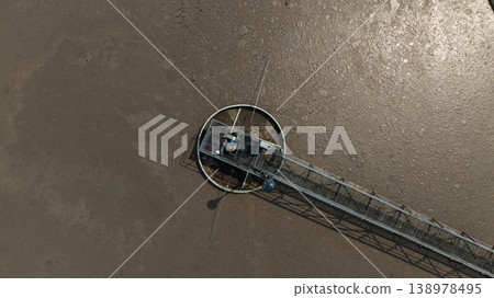 Aerial view wastewater treatment plant. Circular sedimentation tanks biological reactor, Water cleaning facility wastewater treatment plant, Recirculation solid contact clarifier sedimentation tank. Aerial view wastewater treatment plant. Circular sedimentation tanks biological reactor, Water cleaning facility wastewater treatment plant, Recirculation solid contact clarifier sedimentation tank. 138978495