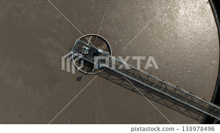 Aerial view wastewater treatment plant. Circular sedimentation tanks biological reactor, Water cleaning facility wastewater treatment plant, Recirculation solid contact clarifier sedimentation tank. Aerial view wastewater treatment plant. Circular sedimentation tanks biological reactor, Water cleaning facility wastewater treatment plant, Recirculation solid contact clarifier sedimentation tank. 138978496