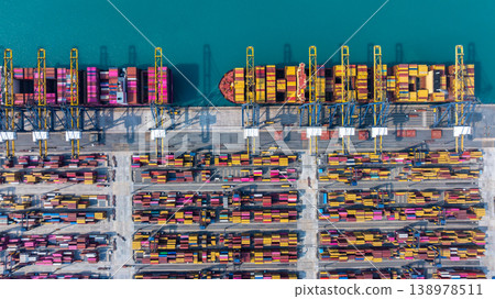 Aerial view Container cargo ship loading unloading container import export sea port, Global trade business container cargo ship freight shipping commercial trade logistic transportation international. Aerial view Container cargo ship loading unloading container import export sea port, Global trade business container cargo ship freight shipping commercial trade logistic transportation international. 138978511