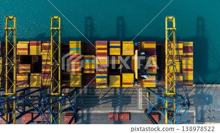 Aerial view Container cargo ship loading unloading container import export sea port, Global trade business container cargo ship freight shipping commercial trade logistic transportation international. Aerial view Container cargo ship loading unloading container import export sea port, Global trade business container cargo ship freight shipping commercial trade logistic transportation international. 138978522