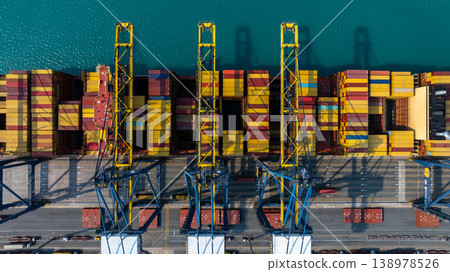 Aerial view Container cargo ship loading unloading container import export sea port, Global trade business container cargo ship freight shipping commercial trade logistic transportation international. Aerial view Container cargo ship loading unloading container import export sea port, Global trade business container cargo ship freight shipping commercial trade logistic transportation international. 138978526