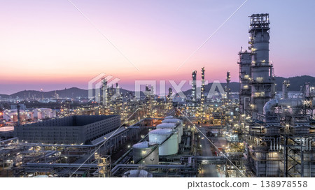 Aerial view oil and gas petrochemical storage tank with oil and gas refinery plant at twilight, Global business power and energy petrochemical industry, Oil and gas refinery petrochemical industrial. 138978558
