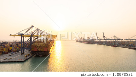 Aerial view Container cargo ship loading unloading container import export sea port, Global trade business container cargo ship freight shipping commercial trade logistic transportation international. Aerial view Container cargo ship loading unloading container import export sea port, Global trade business container cargo ship freight shipping commercial trade logistic transportation international. 138978581