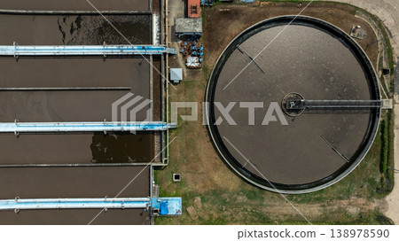 Aerial view wastewater treatment plant. Circular sedimentation tanks biological reactor, Water cleaning facility wastewater treatment plant, Recirculation solid contact clarifier sedimentation tank. Aerial view wastewater treatment plant. Circular sedimentation tanks biological reactor, Water cleaning facility wastewater treatment plant, Recirculation solid contact clarifier sedimentation tank. 138978590