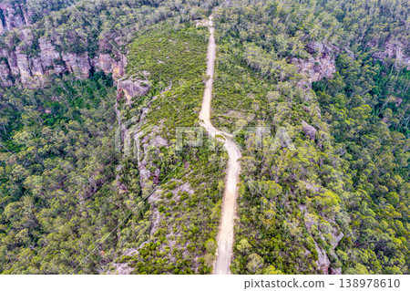 Aerial view over Hargraves Lookout in the Blue Mountains, New South Wales, Australia. The scenic landscape shows dramatic sandstone cliffs, deep valleys and forest covered wilderness Aerial view over Hargraves Lookout in the Blue Mountains, New South Wales, Australia. The scenic landscape shows dramatic sandstone cliffs, deep valleys and forest covered wilderness 138978610