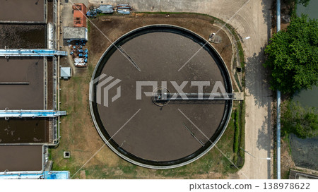 Aerial view wastewater treatment plant. Circular sedimentation tanks biological reactor, Water cleaning facility wastewater treatment plant, Recirculation solid contact clarifier sedimentation tank. Aerial view wastewater treatment plant. Circular sedimentation tanks biological reactor, Water cleaning facility wastewater treatment plant, Recirculation solid contact clarifier sedimentation tank. 138978622