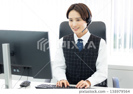 Business woman wearing an intercom Business woman wearing an intercom 138979564
