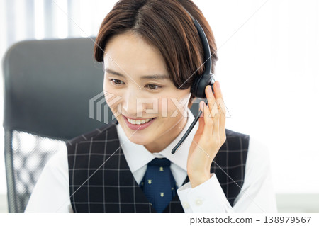 Business woman wearing an intercom 138979567